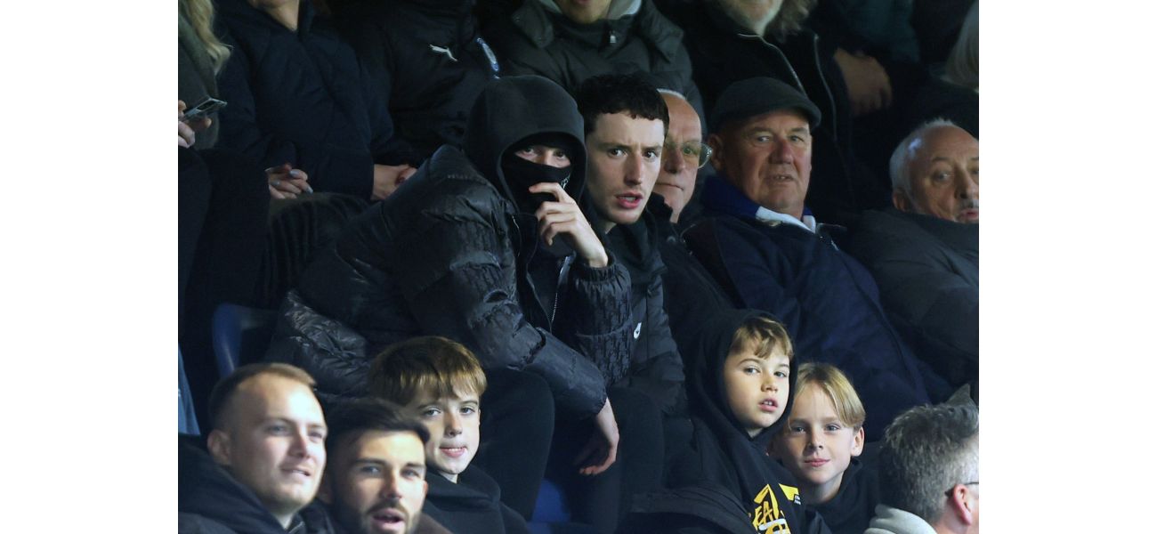 A top English player attends a lower league game without being recognized, following their withdrawal from the national team.