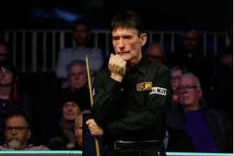 Veteran snooker player Jimmy White defeats much younger opponent in UK Championship qualifying round.