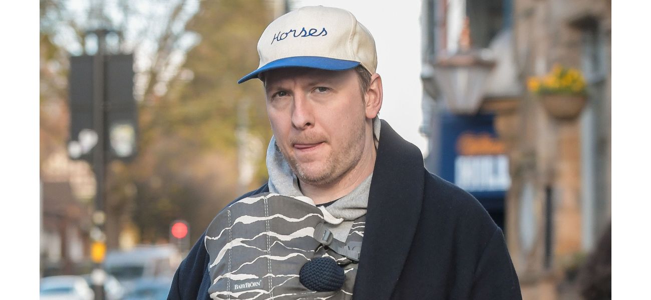 Comedian Joe Lycett looks like a loving father as he takes a walk with his girlfriend and their new baby boy.