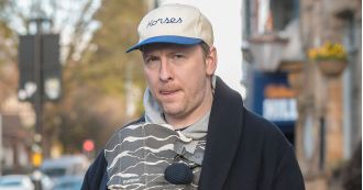 Comedian Joe Lycett looks like a loving father as he takes a walk with his girlfriend and their new baby boy.