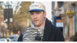 Comedian Joe Lycett looks like a loving father as he takes a walk with his girlfriend and their new baby boy.