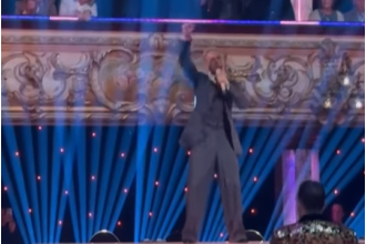 Former X Factor singer surprises audience with impromptu performance during break in Strictly show.