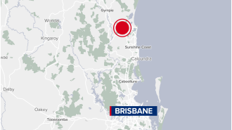 A young person is critically injured following collision between a truck and a car on a highway in Queensland.