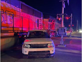 Train crashes into SUV stuck on tracks in Commerce City