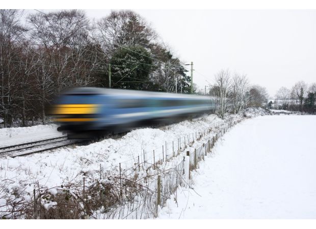 Bad weather disrupts travel in UK with cancelled trains and icy roads.