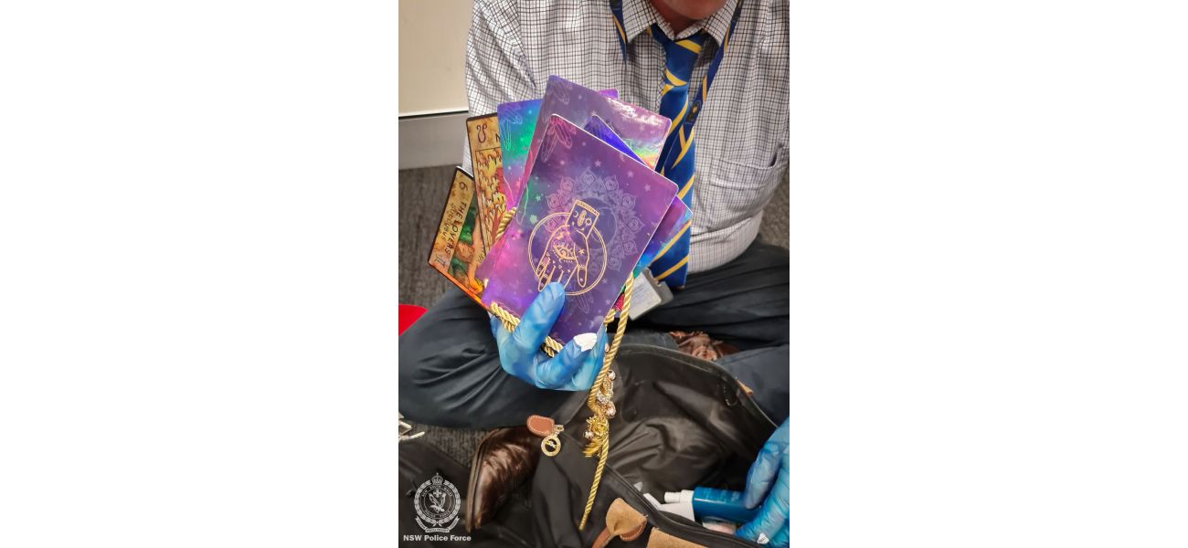 Police arrested a woman for fraud after seizing items like tarot cards and a crystal ball that were allegedly being used in a psychic scam.