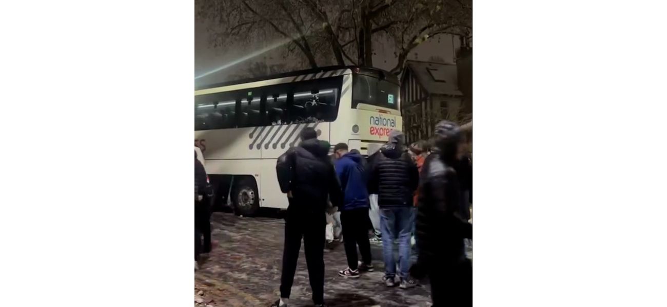 Passengers prevent National Express coach from sliding down icy hill.