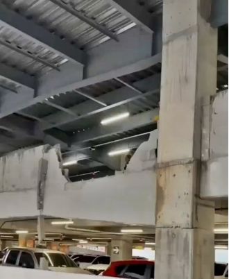 A fatal car crash at a shopping center results in one death as the car lands on a kiosk.