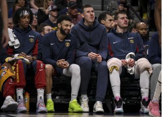 Nuggets player Vlatko Cancar hurt his left knee during a game and had to leave.