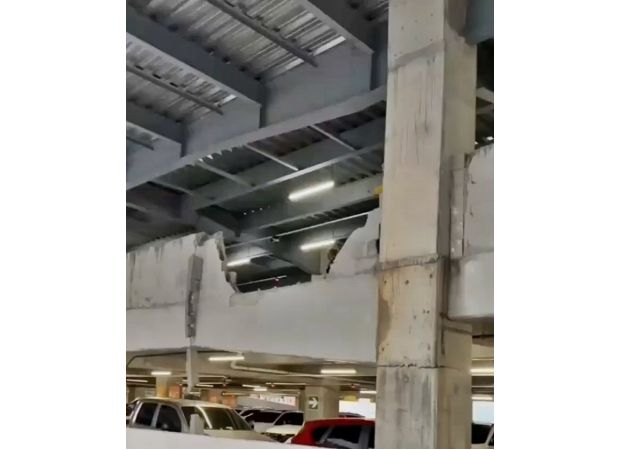 A fatal car crash at a shopping center results in one death as the car lands on a kiosk.