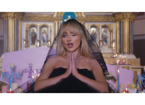 A priest was dismissed for permitting a famous singer to shoot a provocative music video in their church.