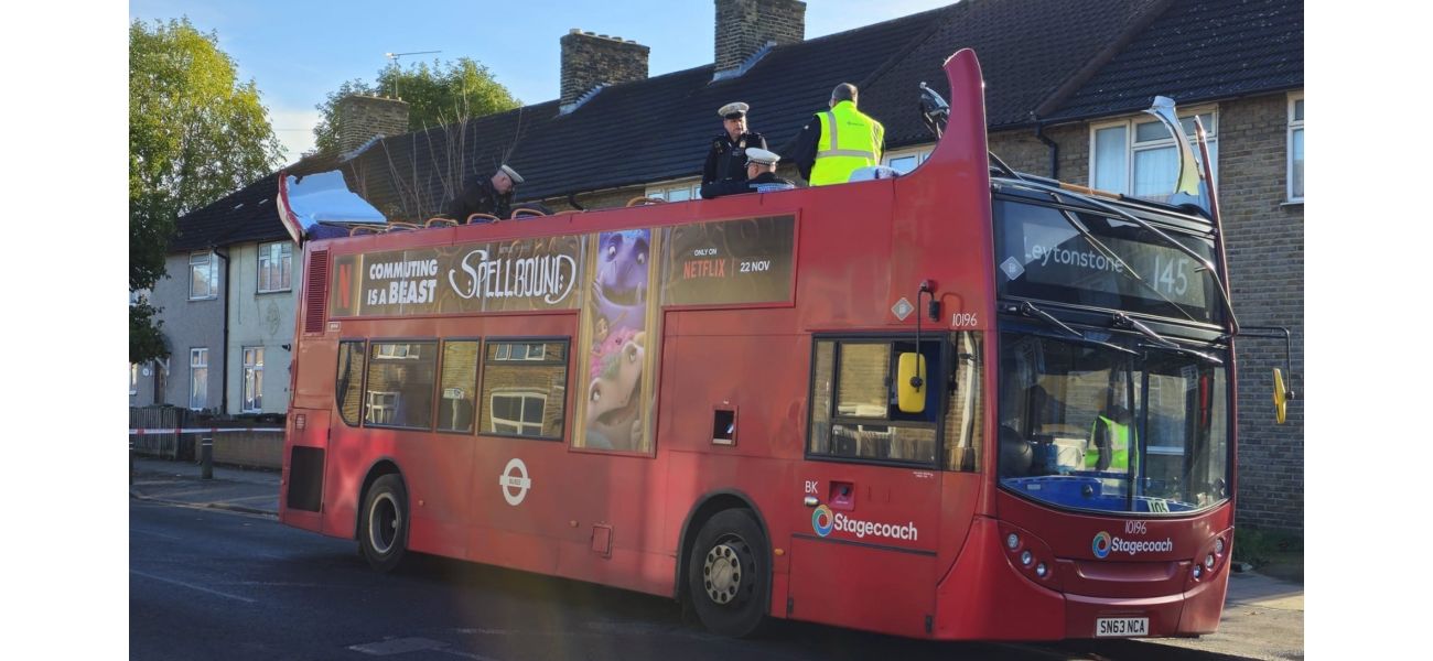 Bus crashes into tree in London, causing roof to come off.