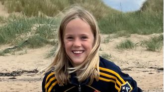 An 11-year-old boy died after being struck by a car while leaving his school.