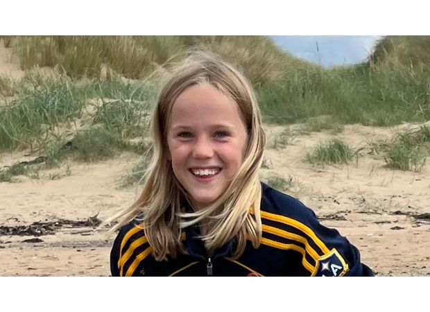 An 11-year-old boy died after being struck by a car while leaving his school.