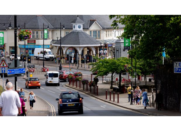 14-year-old girl and man critically injured in town center when van collides with pedestrians.