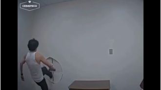 Suspect escapes by breaking through wall in interrogation room.