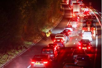 Cars stranded all night in icy weather due to major accident on highway.
