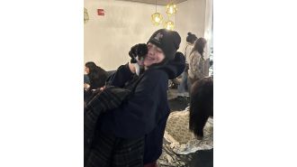 Billie Eilish cuddles with rescue dog and pony before performing in Denver.