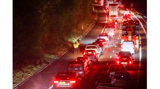 Cars stranded all night in icy weather due to major accident on highway.