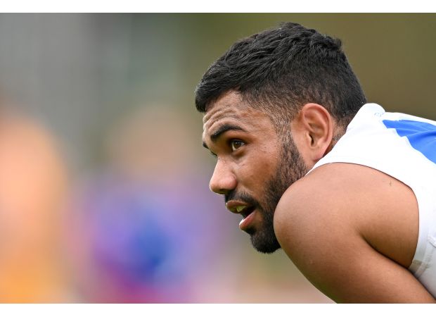 Harassment charge against former AFL player Tarryn Thomas dropped.