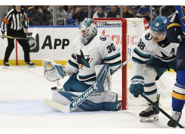 Askarov has strong debut for Sharks, but they lose in shootout to Blues.