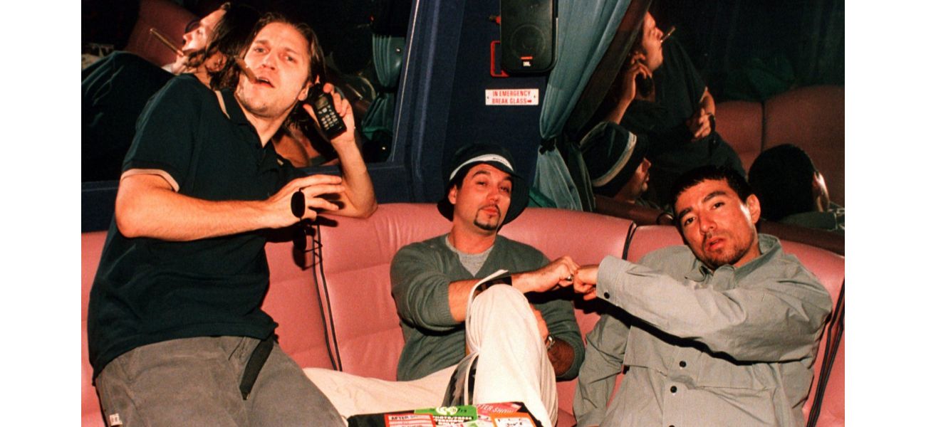 The former lead singer of a 90s rock band is in a heated dispute with his former bandmates, calling them cowardly.