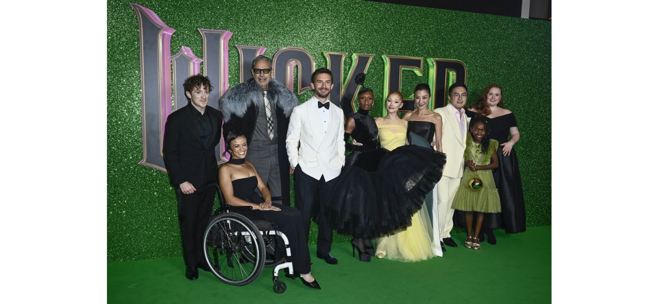 A lead in Wicked slips and falls at wet premiere in London.