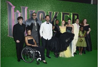 A lead in Wicked slips and falls at wet premiere in London.