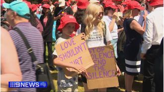 Thousands march against domestic violence as family of teen Isla Bell, who was killed, joins the cause.