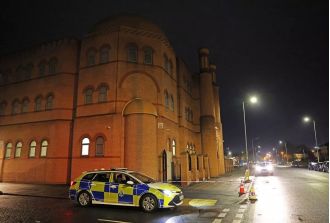 Authorities are searching for a man who allegedly brandished a gun during an attack at a mosque.