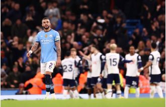Kyle Walker predicts trouble for Man City in upcoming game against Liverpool.