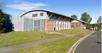Large number of prisoners fall ill in UK jail, causing one of the biggest outbreaks of sickness ever recorded.
