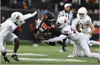 Oregon State breaks losing streak, earns conference title with 41-38 victory against ranked Washington State.