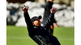 DU men's soccer coach prioritizes player development over short-term success in the transfer portal era.