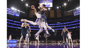 Nuggets' coach Michael Malone sets new wins record, leading team to another victory over Lakers.