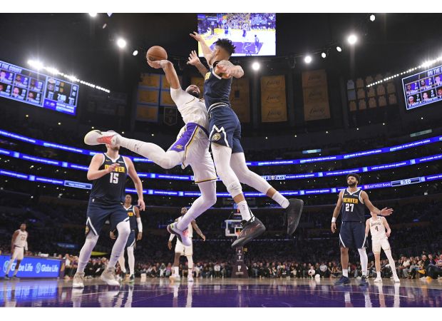 Nuggets' coach Michael Malone sets new wins record, leading team to another victory over Lakers.