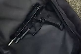 Police engage in physical struggle to stop man on electric bike from escaping with firearm.