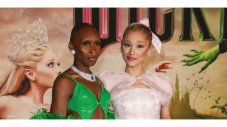 Pop star Ariana Grande shocks social media by holding onto singer Cynthia Erivo's finger.