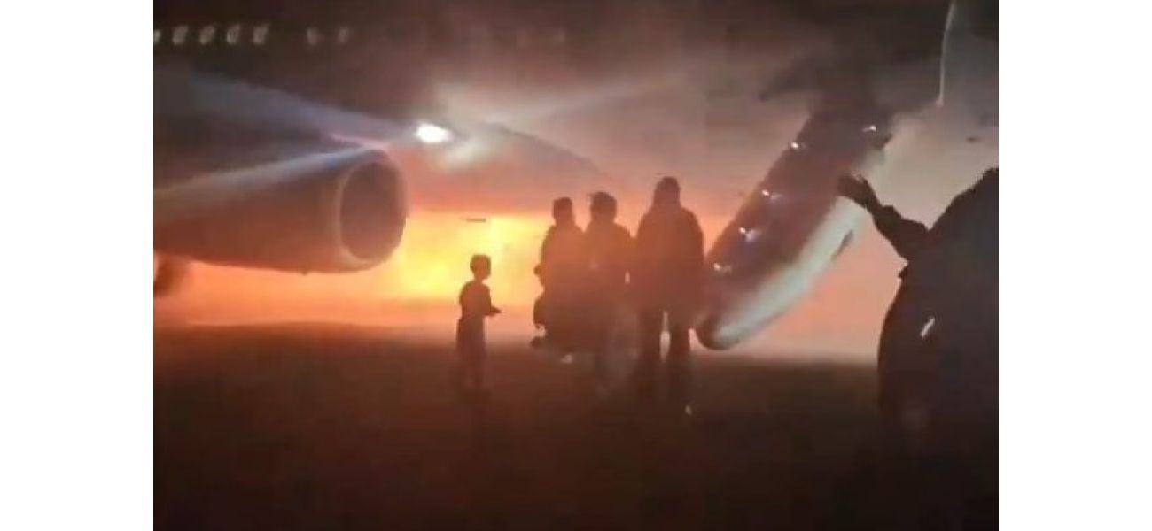 People escaped by sliding down emergency chutes as the plane caught fire during its landing.