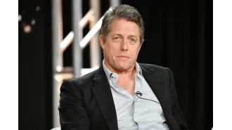 Actor Hugh Grant was spotted getting intimate with a star from Real Housewives during a night of heavy drinking.