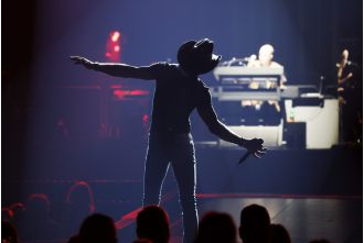 Famous country star undergoes dramatic transformation with more subdued appearance, trading in muscular physique for a simpler style.