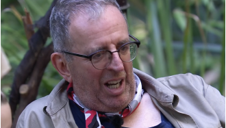 Campmate on I'm A Celebrity surprises Reverend Richard Coles with sex education, leaving him blushing.