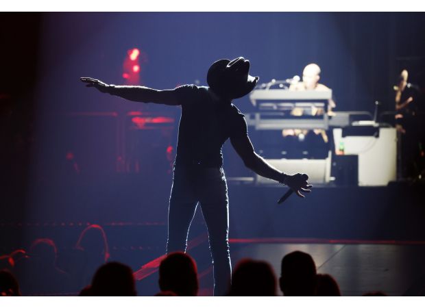 Famous country star undergoes dramatic transformation with more subdued appearance, trading in muscular physique for a simpler style.