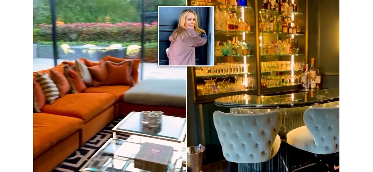 Amanda Holden shows off her newly renovated £7 million home, complete with a bold and edgy poster.