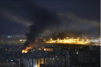 A brave pilot continues to fly evacuation missions despite missiles landing dangerously close.