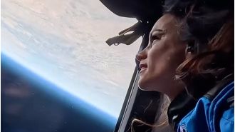 A woman astronaut faces online sexism despite her journey to space.