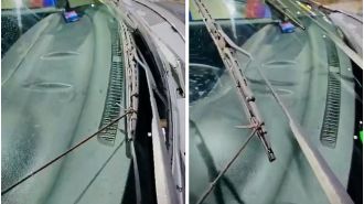 Man caught using shoelaces to control wipers during storm.