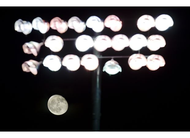 Accusations fly between school district and coach after finding racist, homophobic messages in visiting locker room at playoff game.