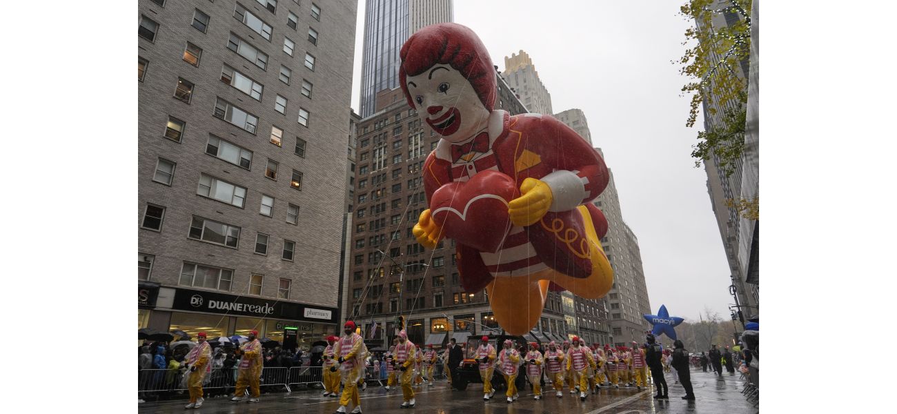 The Macy's Thanksgiving Day Parade included large balloons, rainy conditions, and 21 arrests of protesters.