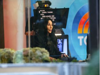 Cher calls 80s film director a 'pig' following release of controversial memoir.